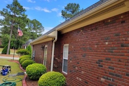 Downspout and gutter cleaning on a one story house in fayetteville